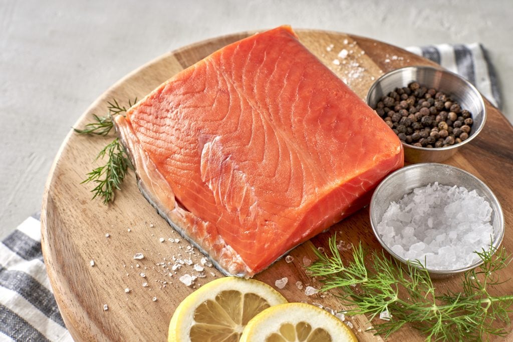 Raw salmon on a cutting board