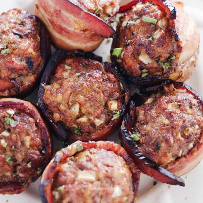 Bacon-wrapped meatballs on a white plate